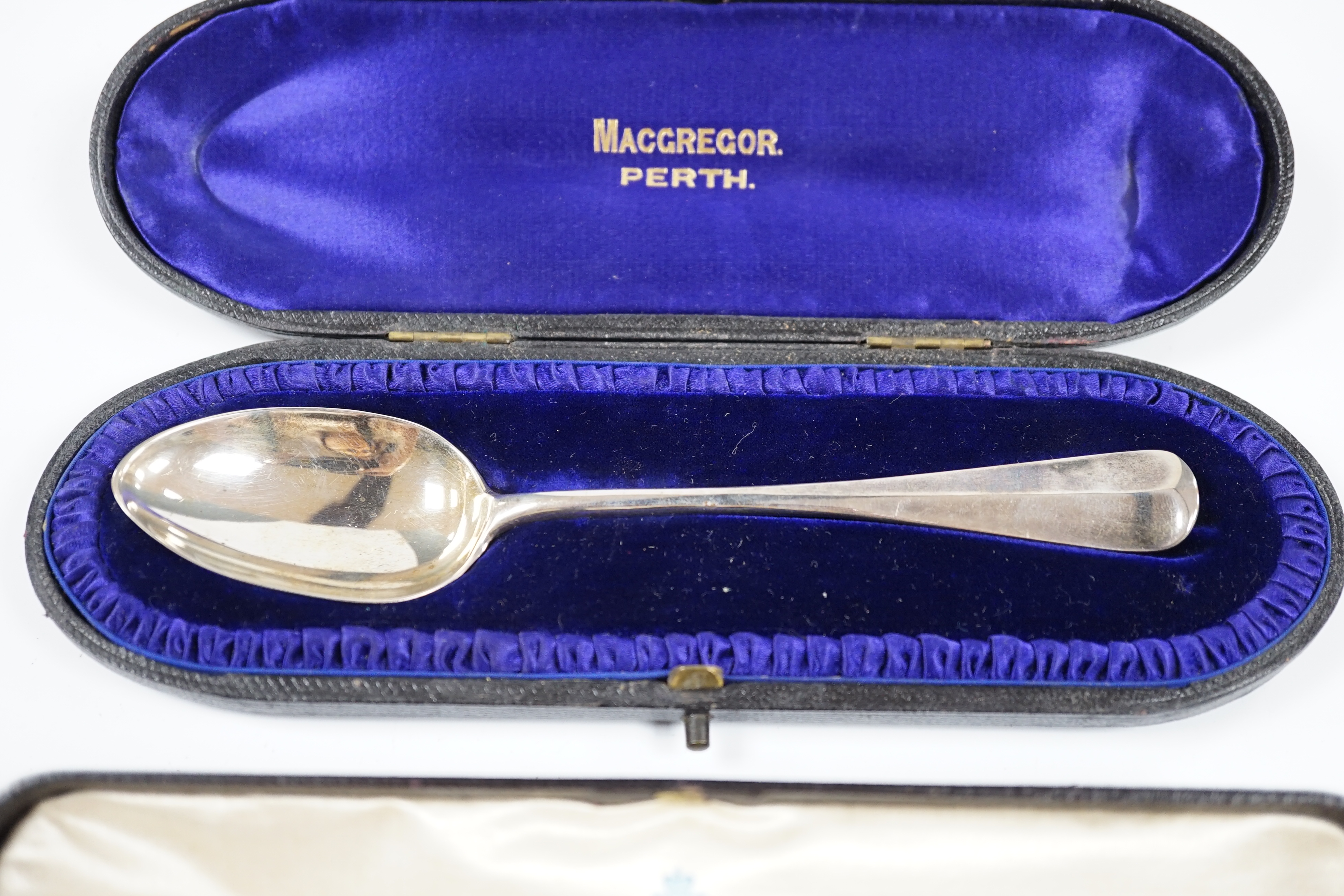 A cased Russian 84 zolotnik spoon, 16.8cm and a cased Victorian silver dessert spoon, London, 1893. Condition - fair to good